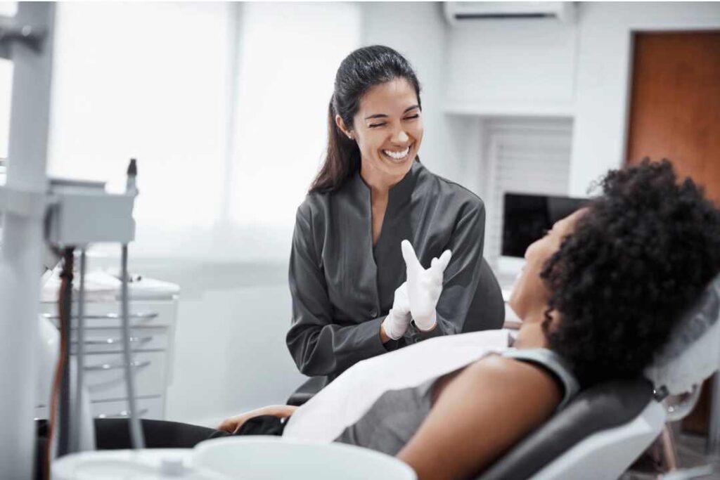 Patient and dentist discussing dental implant recovery stages