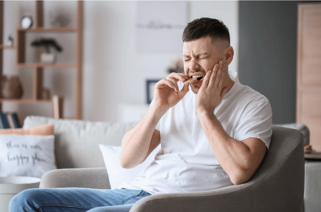 man feels pain when eating cookie